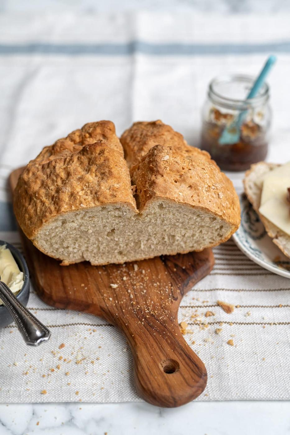 soda bread loaf with slice cut out on a wooden board