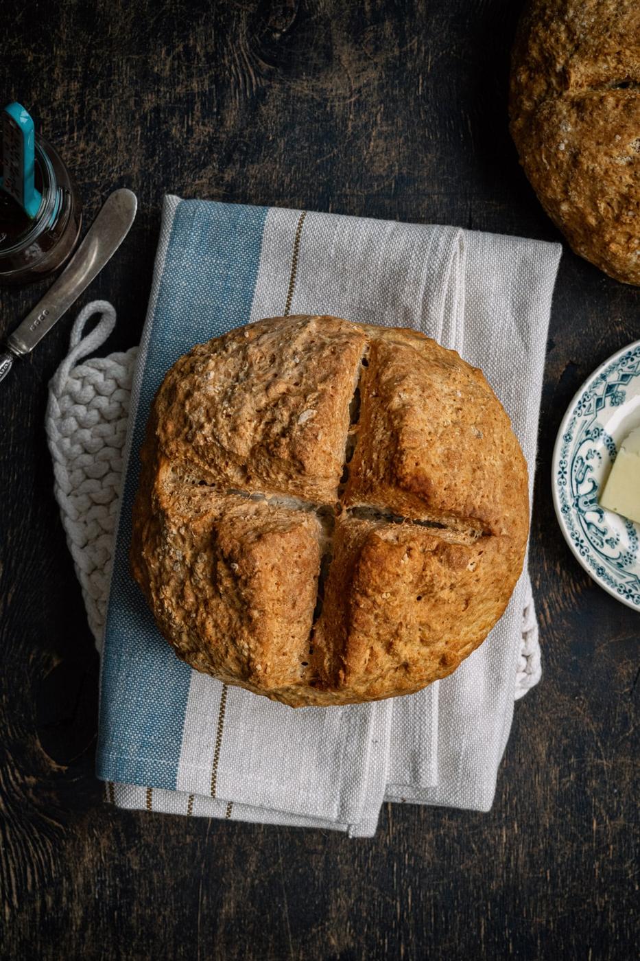 three ingredient soda bread, whole loaf, on a linen towel