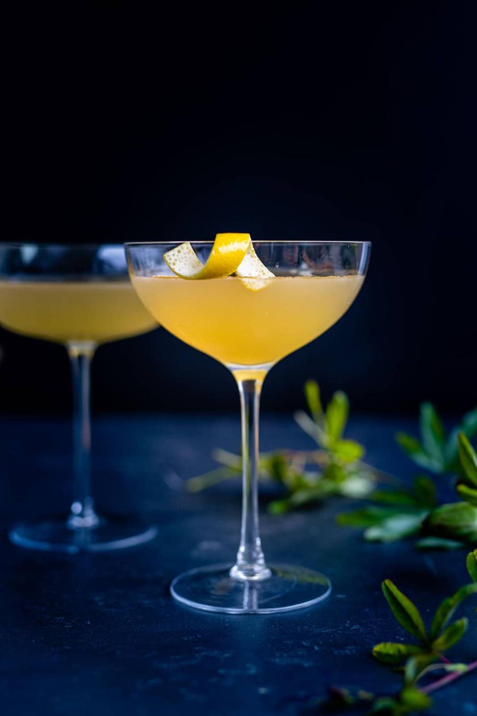 Corpse Reviver 2 in a cocktail glass garnished with lemon peel