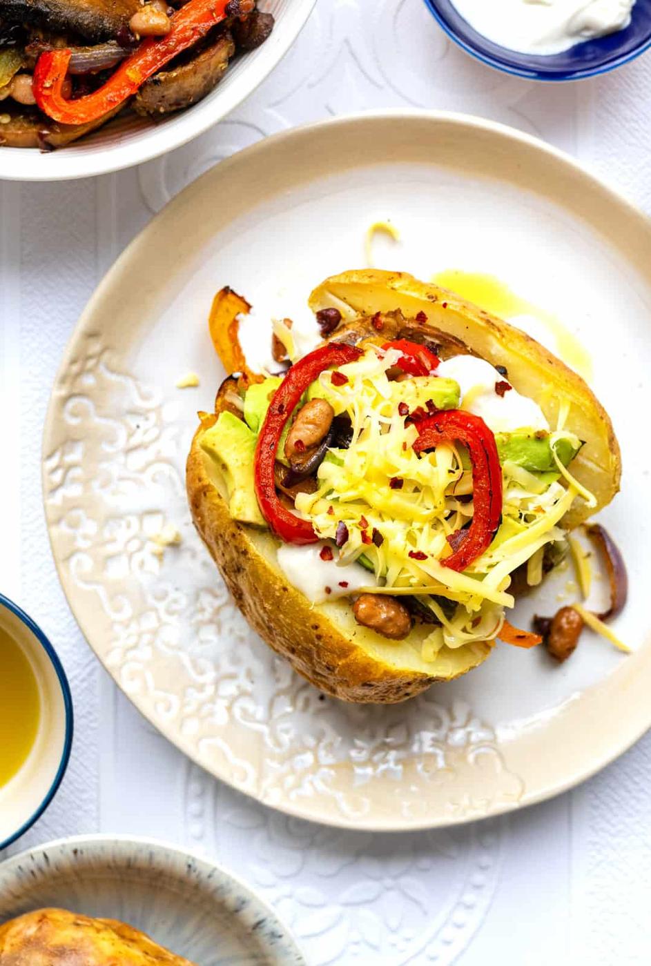 baked potato topped with vegan fajitas