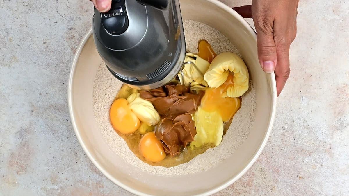 Flour, sugar, butter, eggs and biscoff spread in a mixing bowl