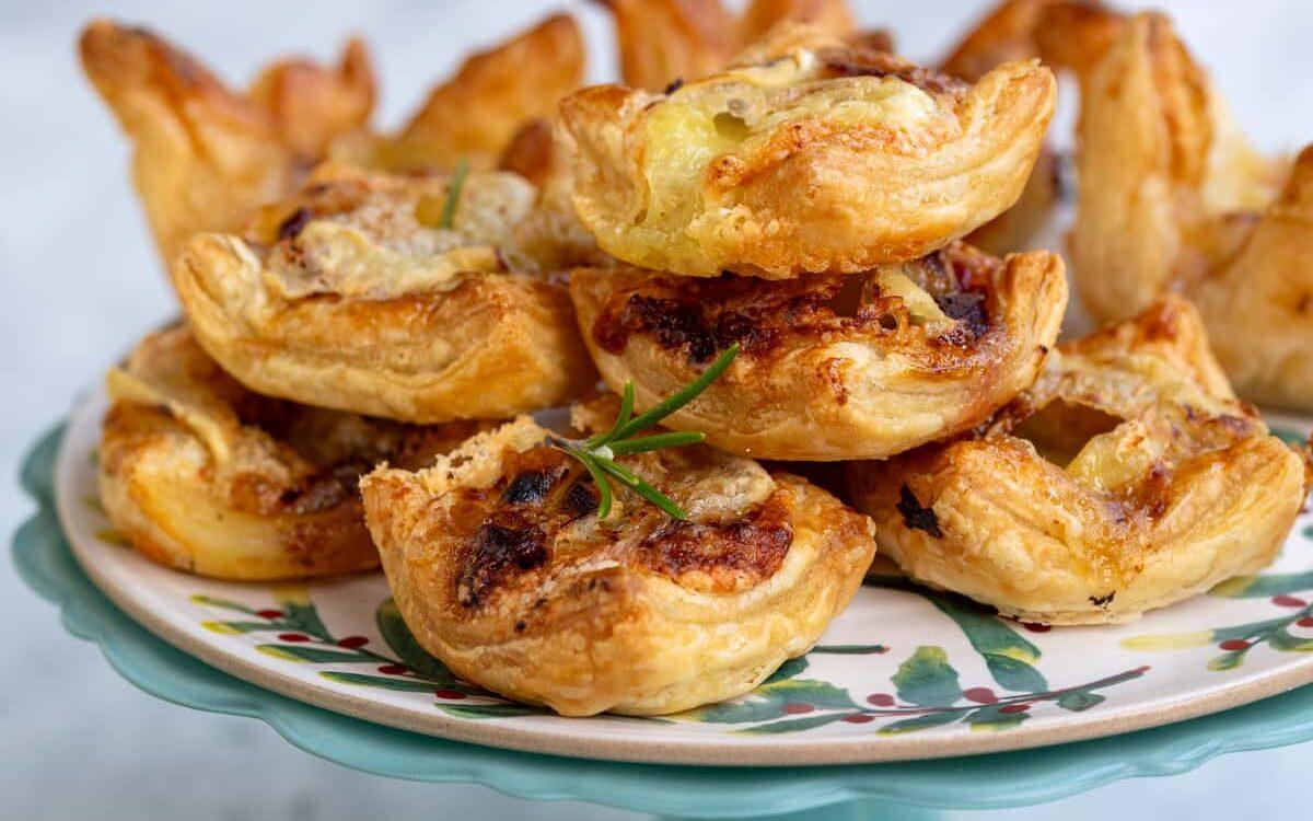 Air Fryer Brie and Cranberry bites piled on a cake stand