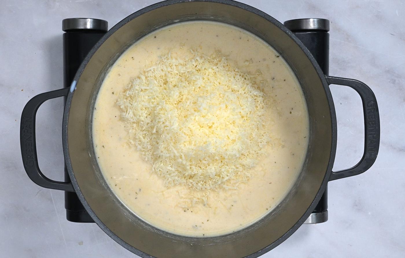 making cheese sauce in a pot