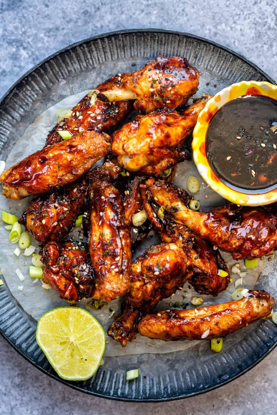 chicken wings with dipping sauce on the side