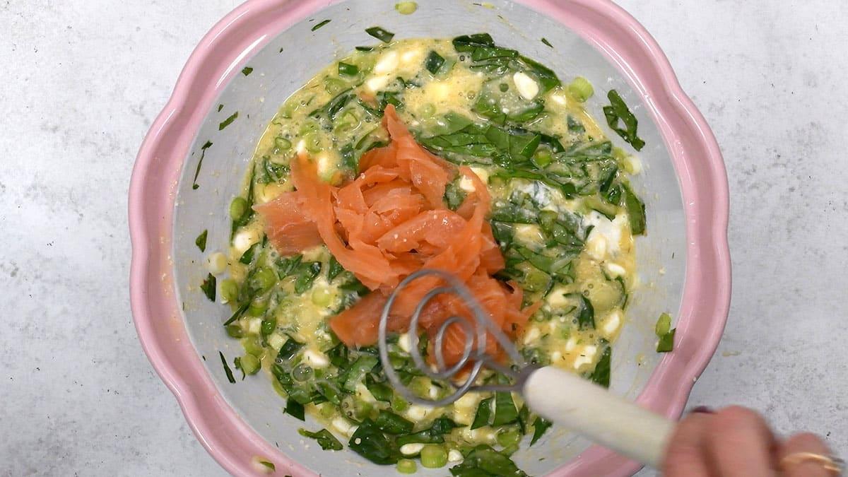 preparing frittata in a mixing bowl