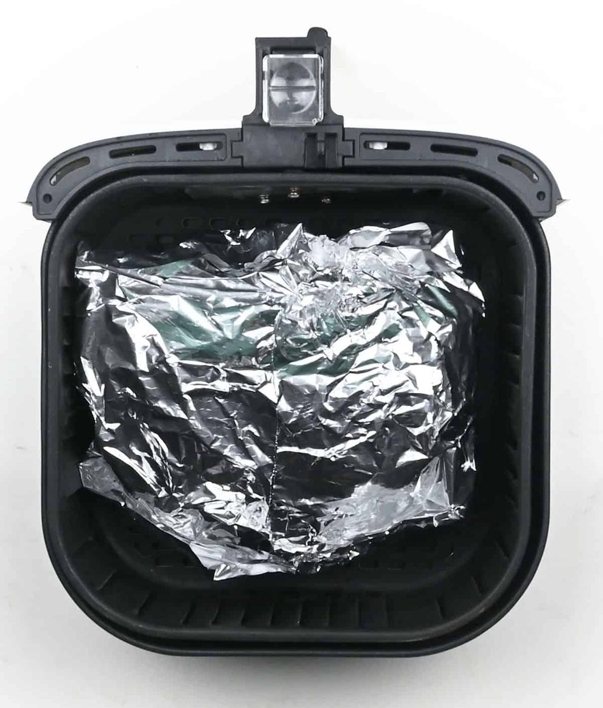 Wrapped gammon joint in the basket of an air fryer