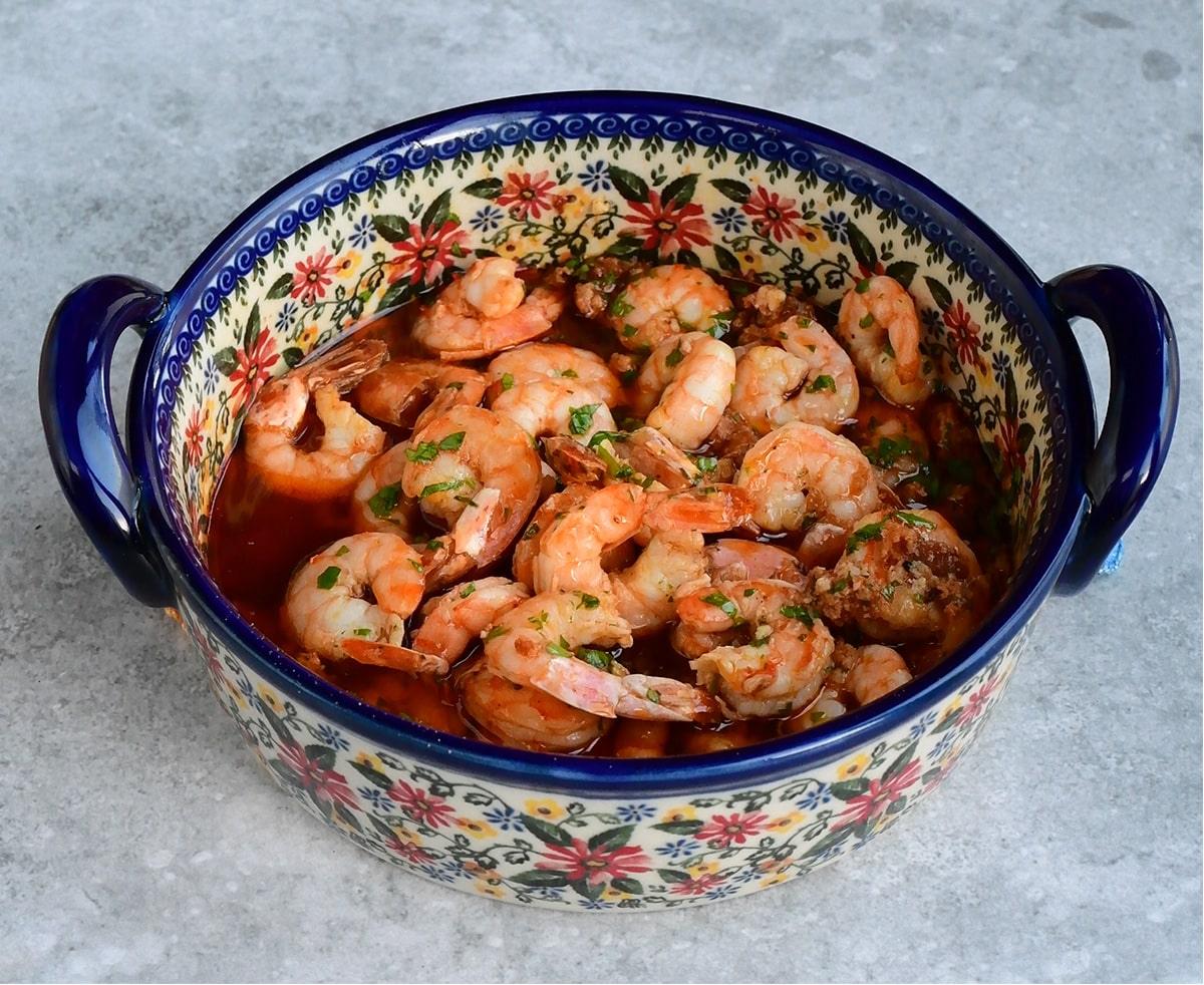 Spanish garlic chili prawns in a ceramic patterned dish