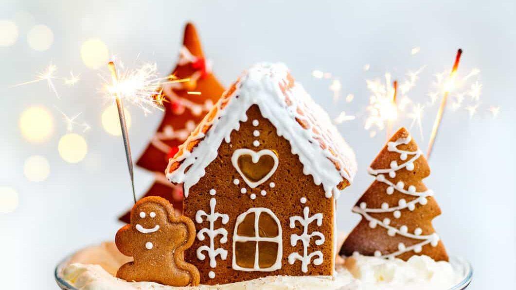 Gingerbread trifle decorated with a gingerbread house and cookies