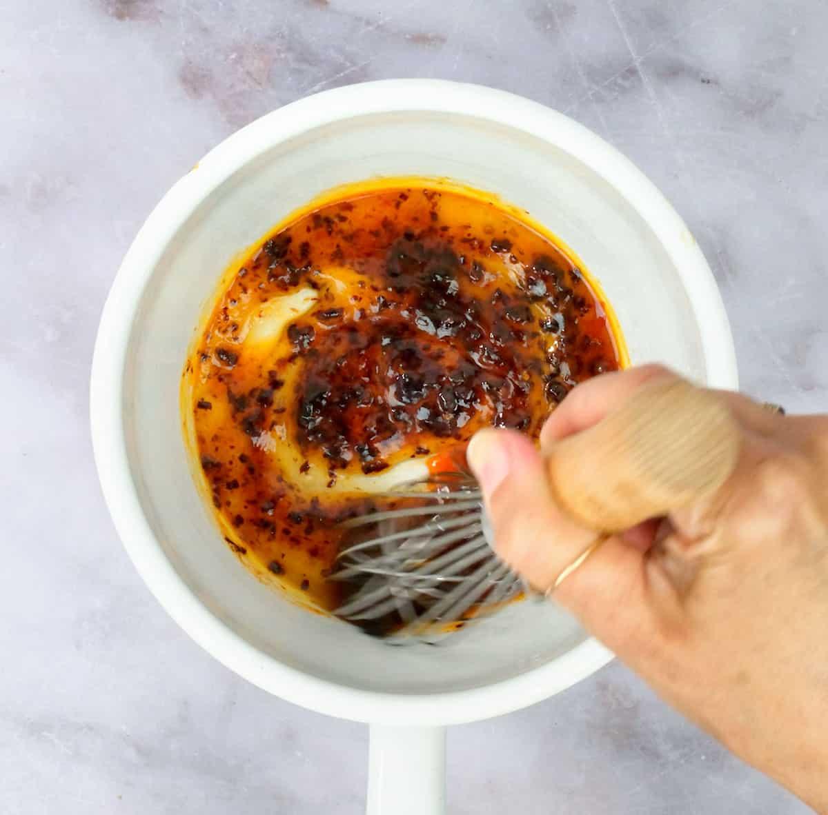 making homemade hot honey sauce