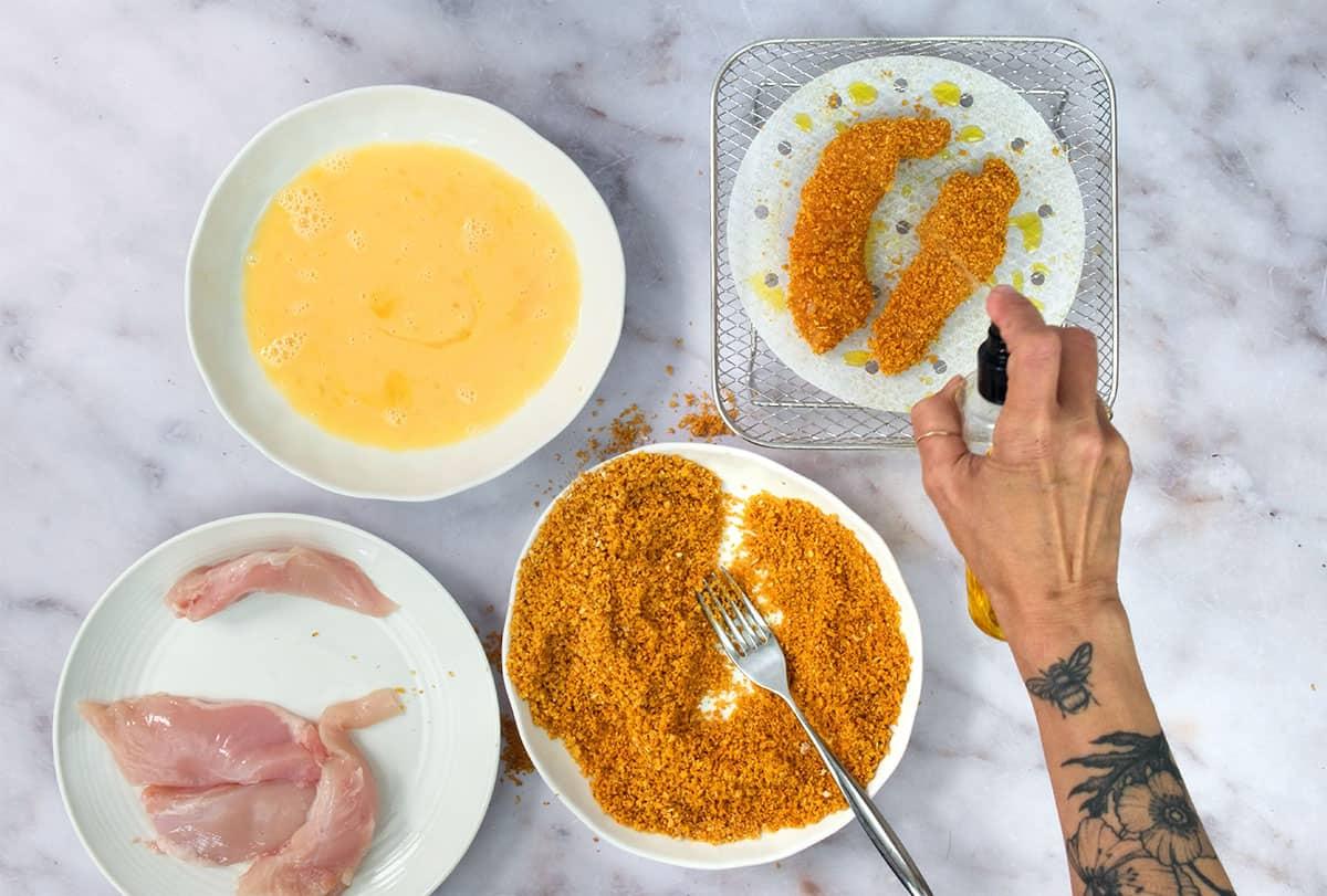 prepping chicken strips for air frying