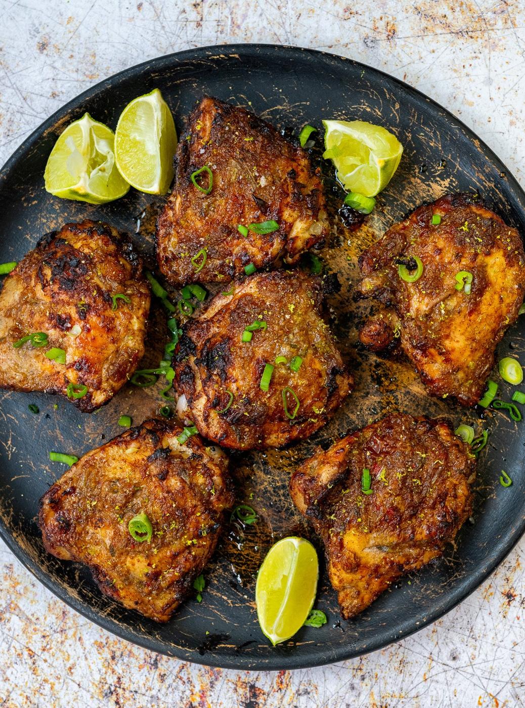 Jamaican jerk chicken on a wooden platter