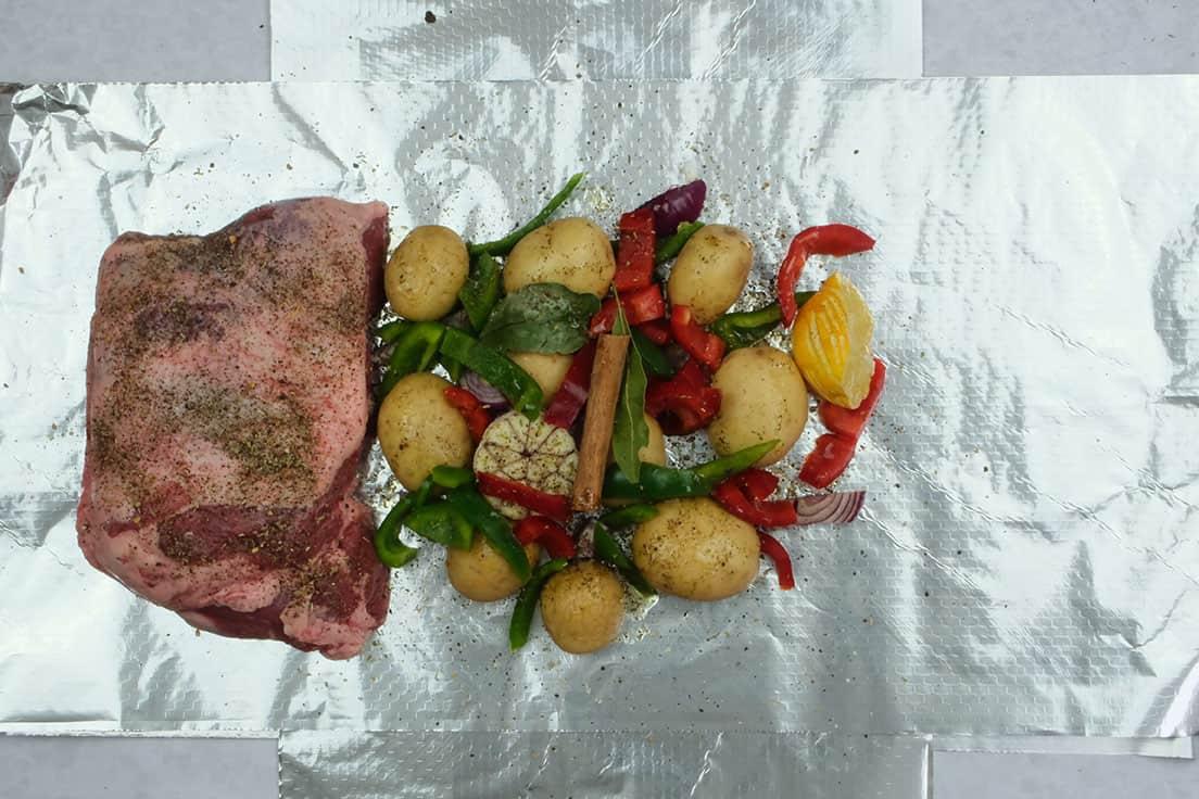 seasoned lamb with vegetables on the side
