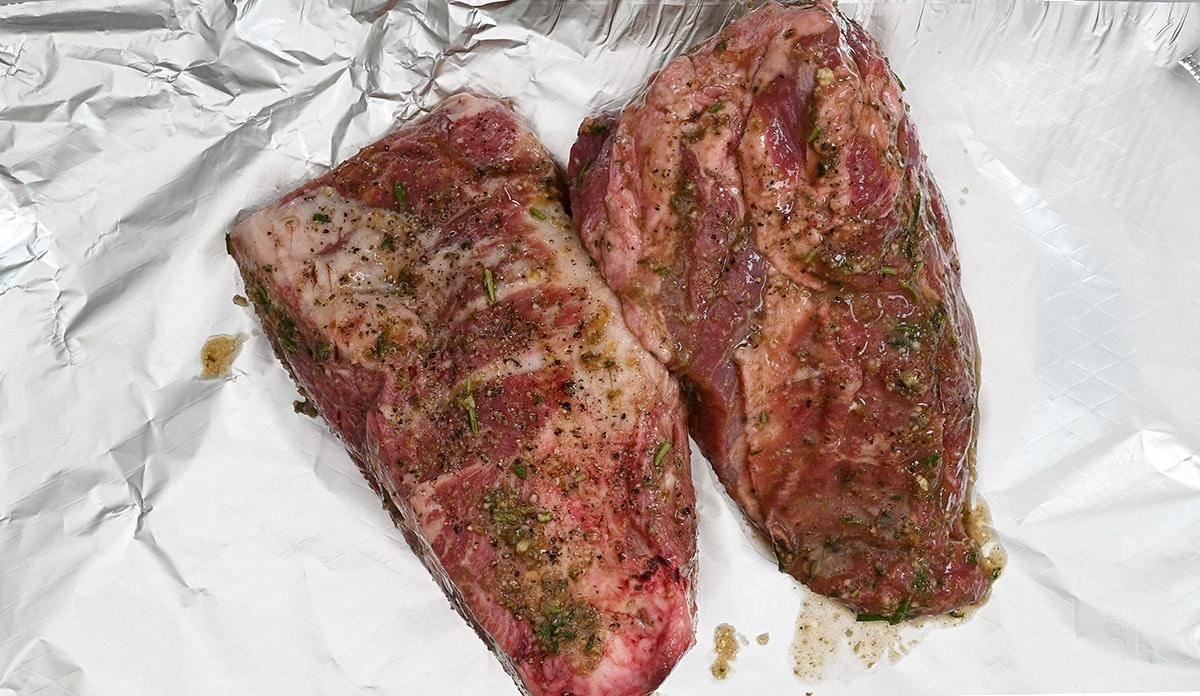 marinated half shoulders of lamb on foil