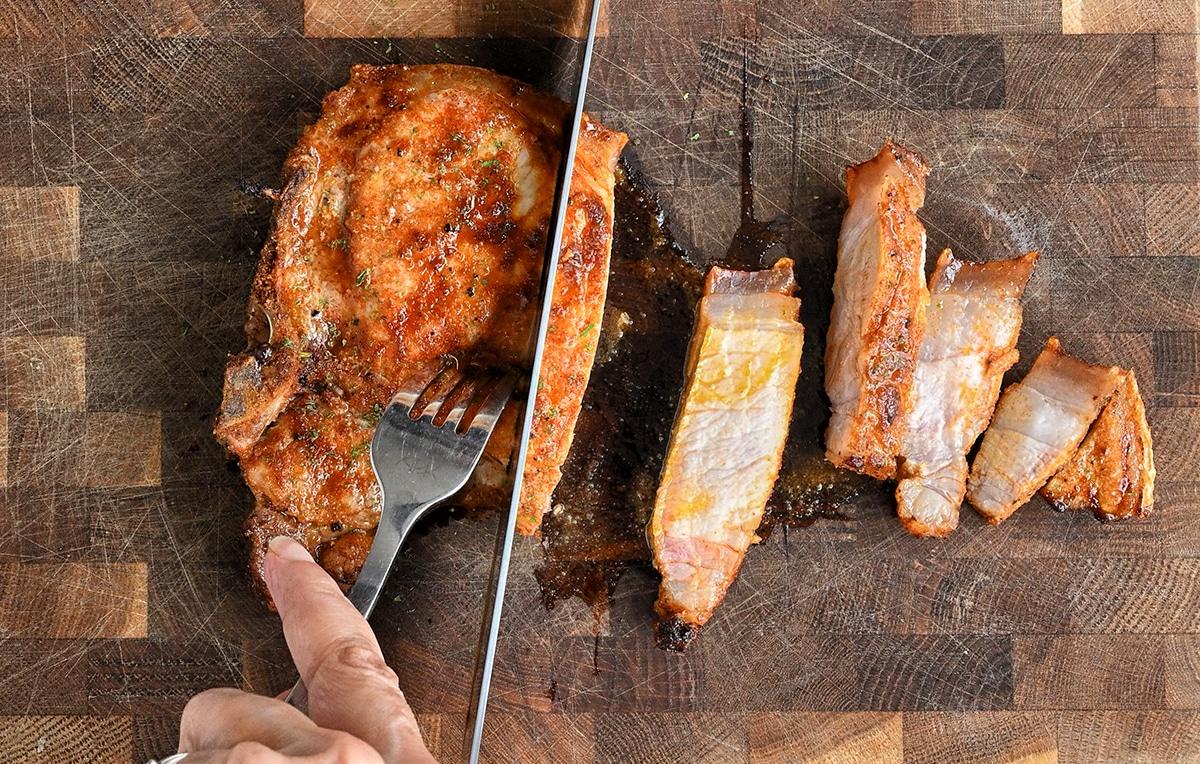slicing a pork chop