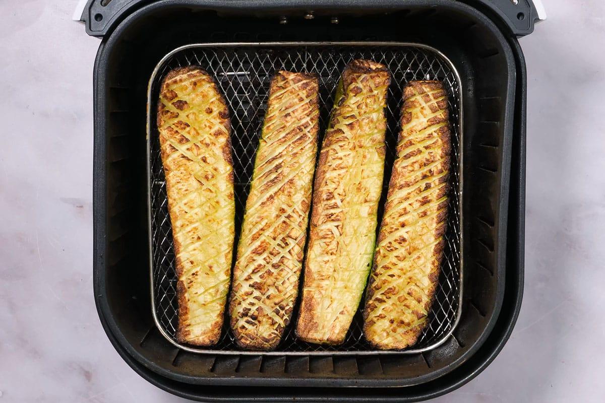air fried zucchini in the basket of air fryer