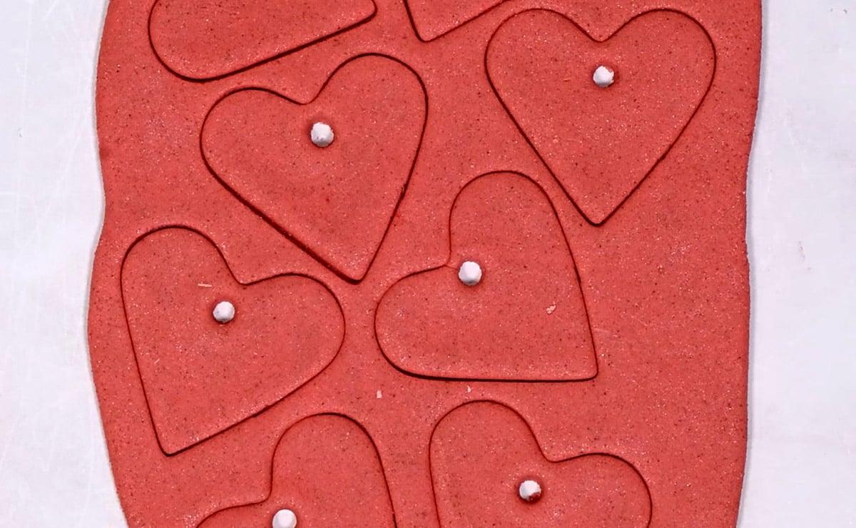 salt dough rolled out with heart shapes cut