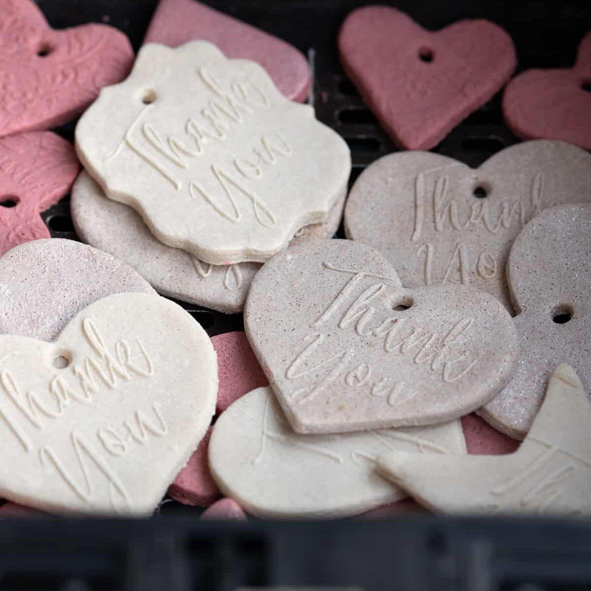 salt dough ornaments in an air fryer basket