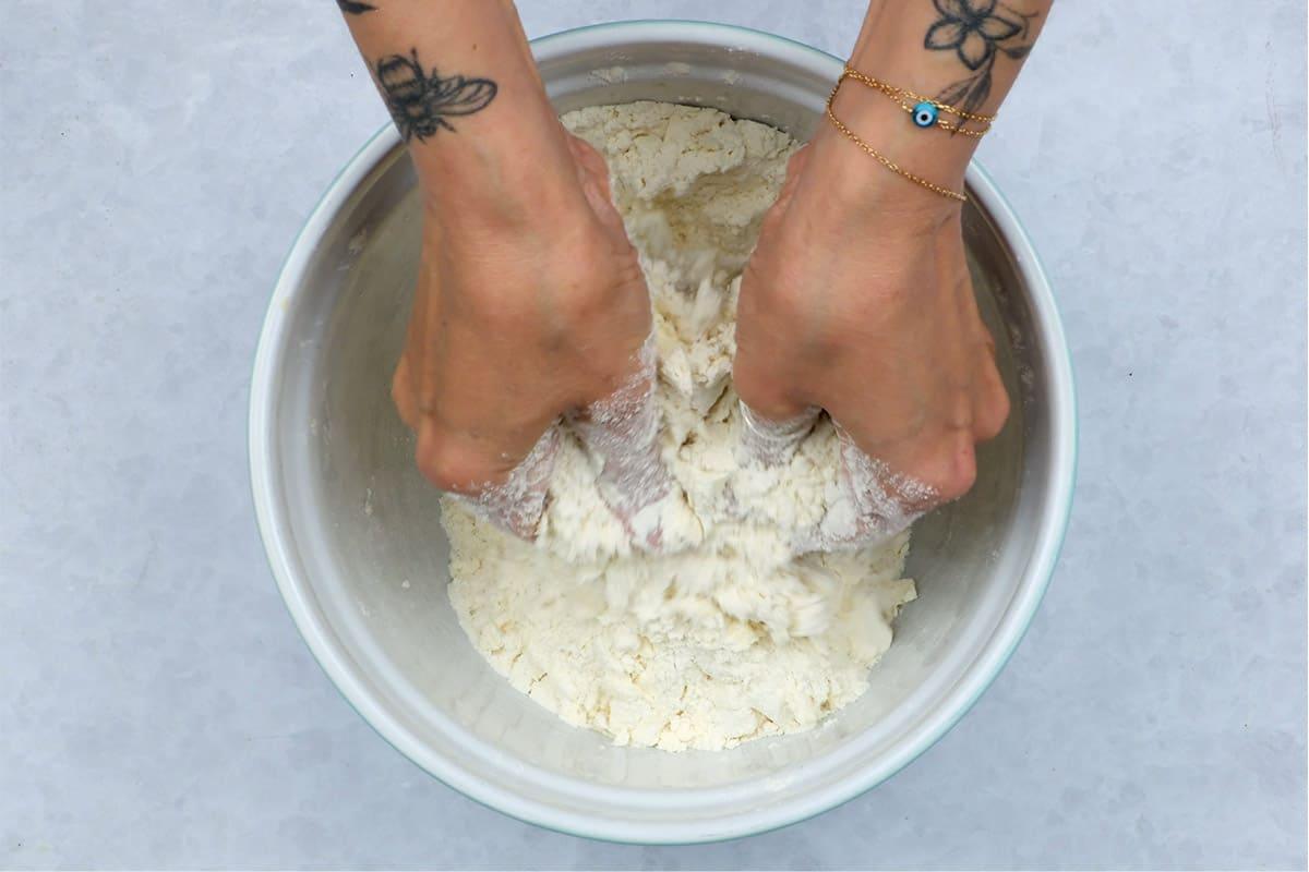 rubbing butter into flour in a bowl