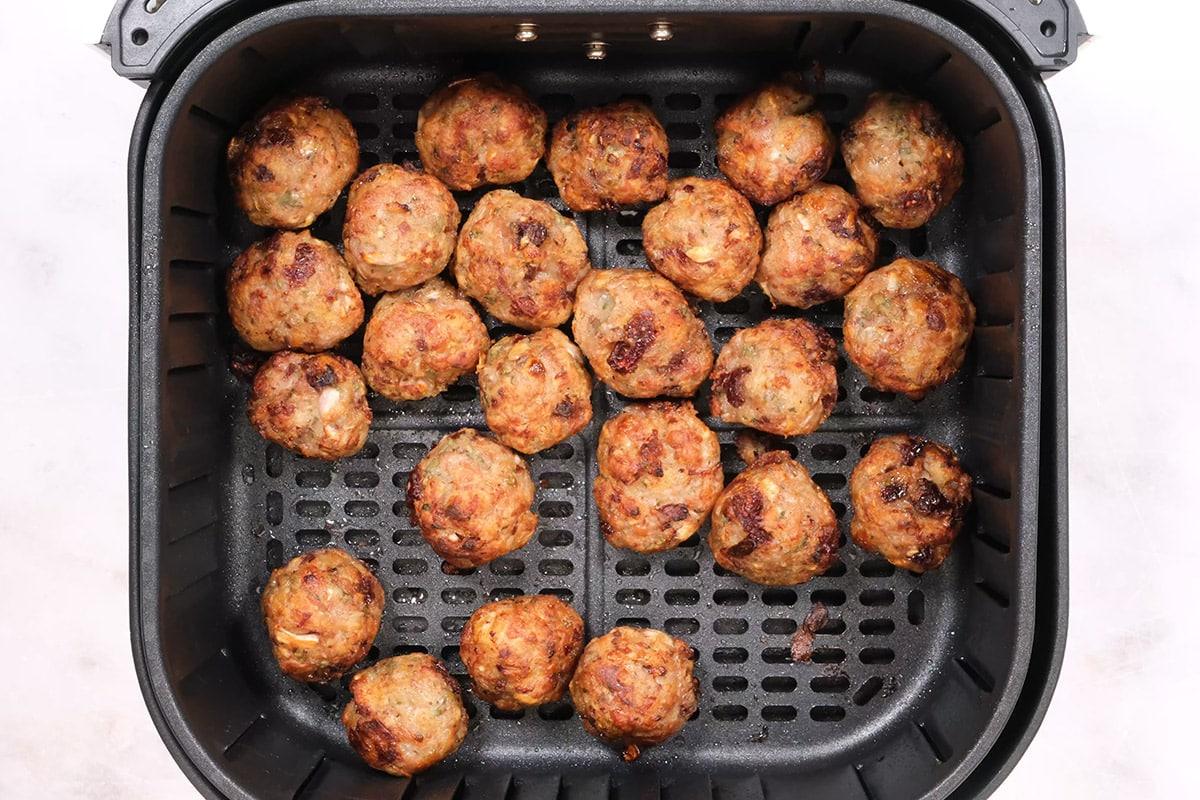 crispy stuffing balls in the basket of an air fryer