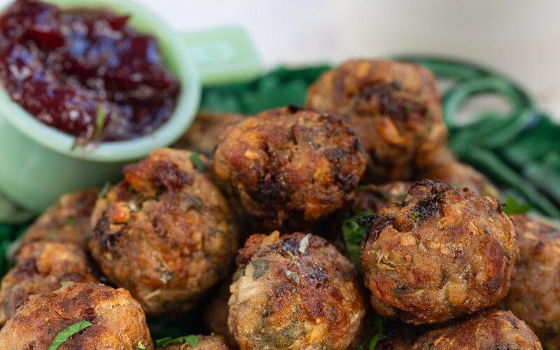 air fryer stuffing balls served with cranberry sauce on the side