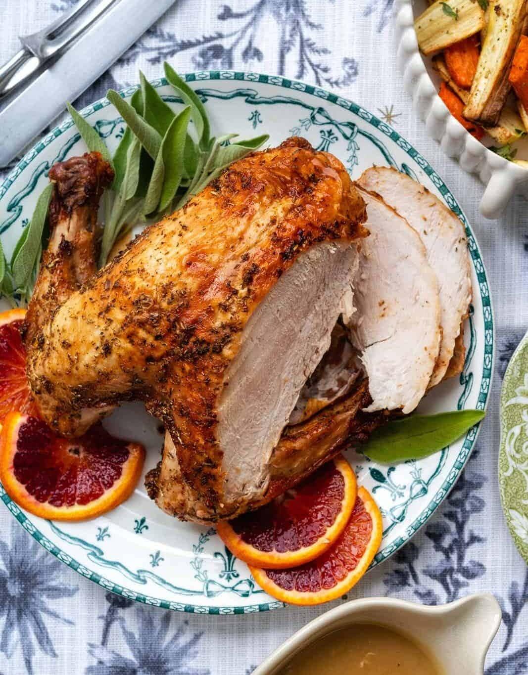 Air Fryer turkey on a platter, with two slices cut