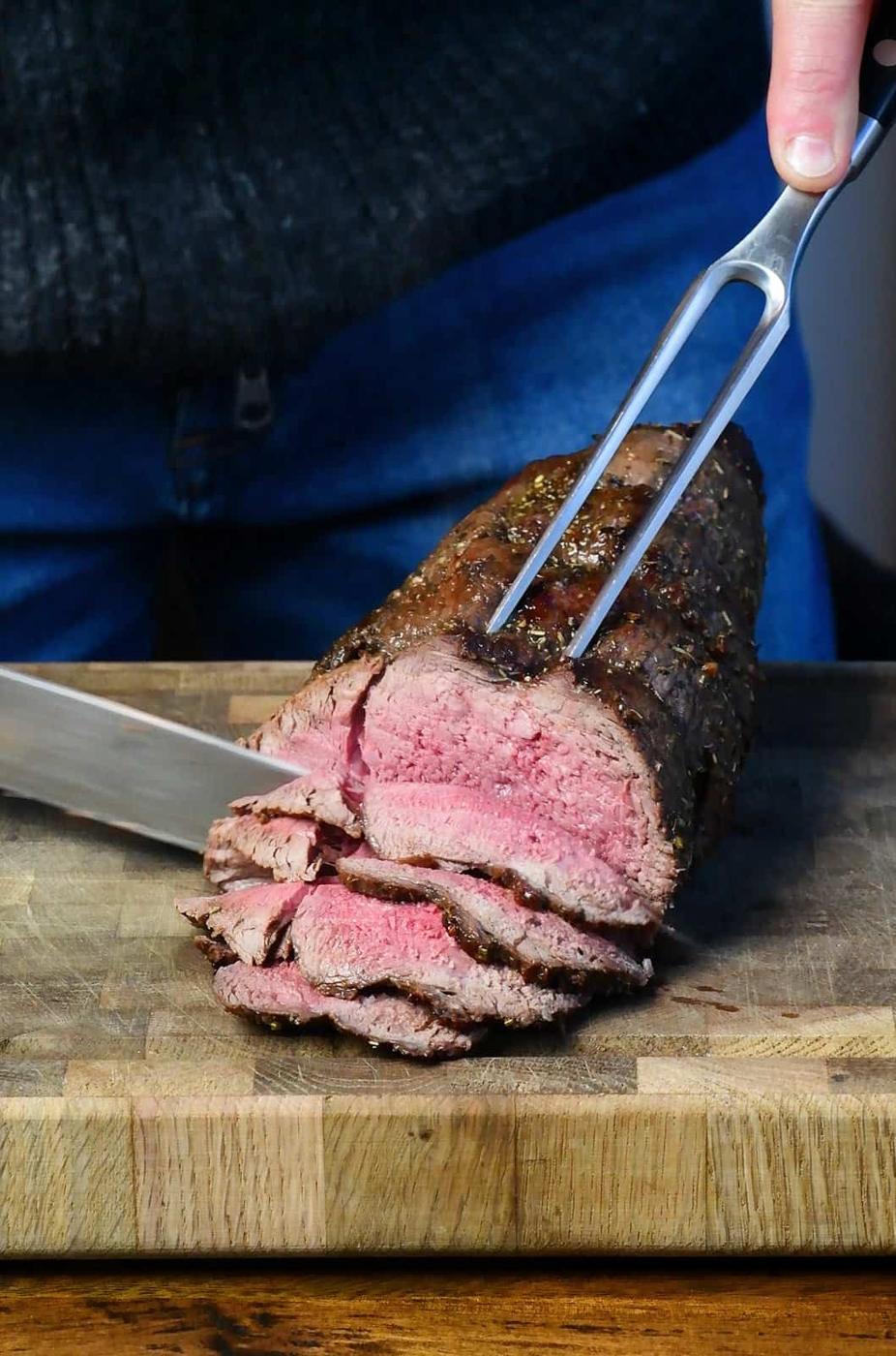 Carving roasted venison haunch
