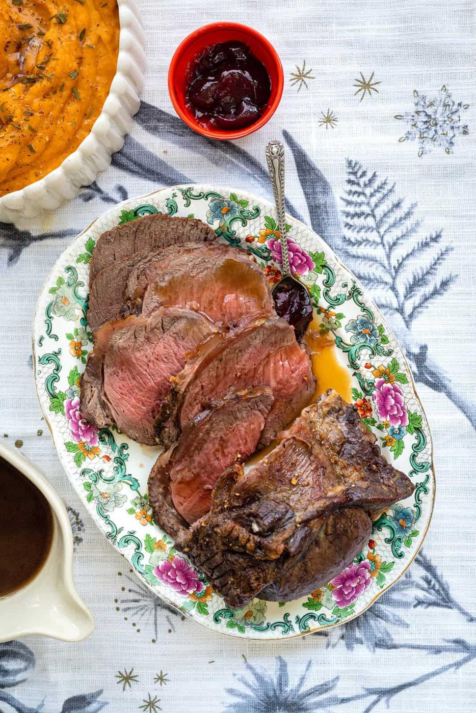 sliced venison roast on a platter