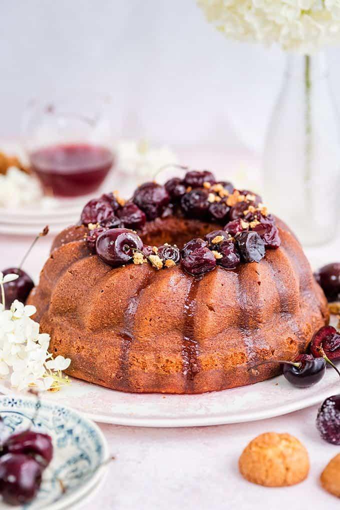Amaretti ricotta semolina bundt cake with cherry compote – delicious served warm with a little crème fraîche on the side.