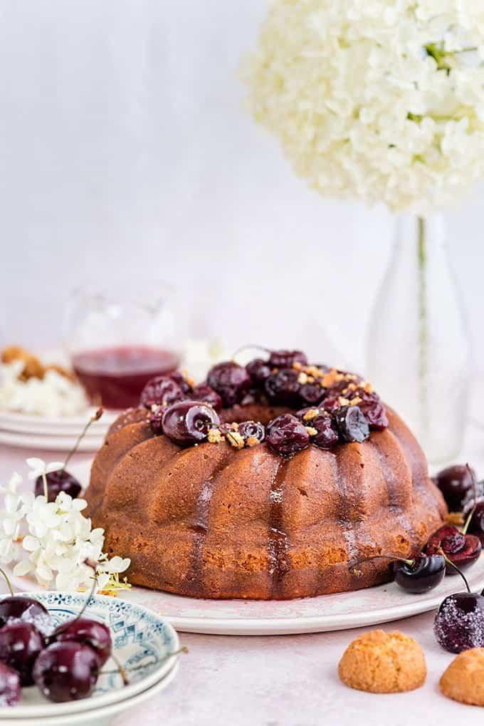 Amaretti ricotta semolina bundt cake with cherry compote – delicious served warm with a little crème fraîche on the side.