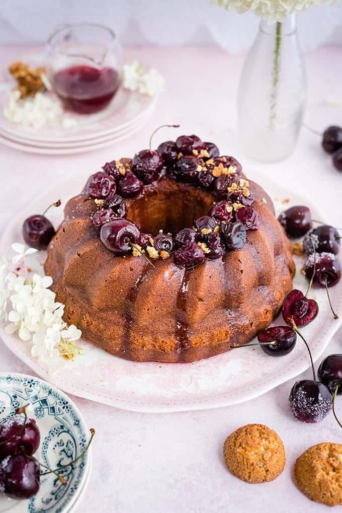 Amaretti ricotta semolina bundt cake with cherry compote – delicious served warm with a little crème fraîche on the side.
