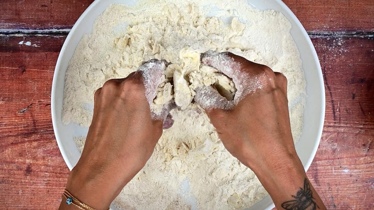 rubbing butter into flour and sugar to make crumble topping