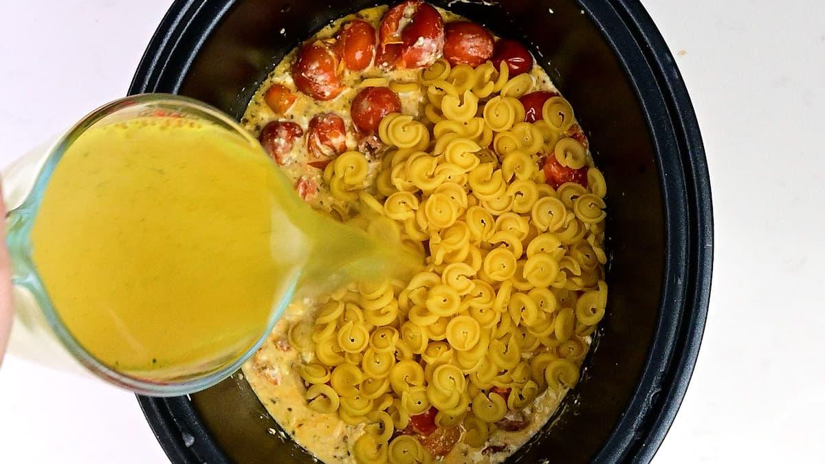 Adding pasta and vegetable stock to crockpot