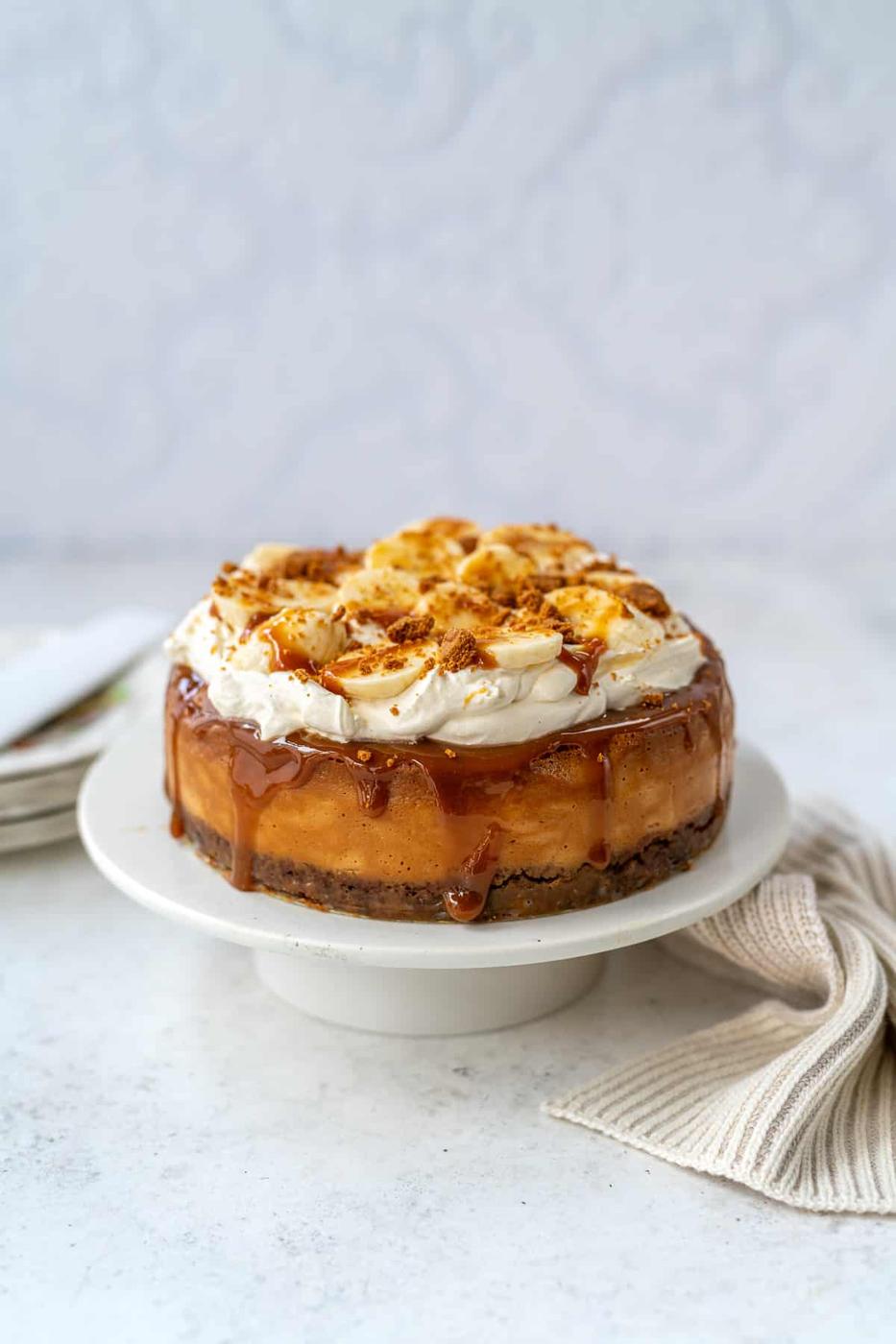 Baked Banana and Caramel cheesecake on a stand