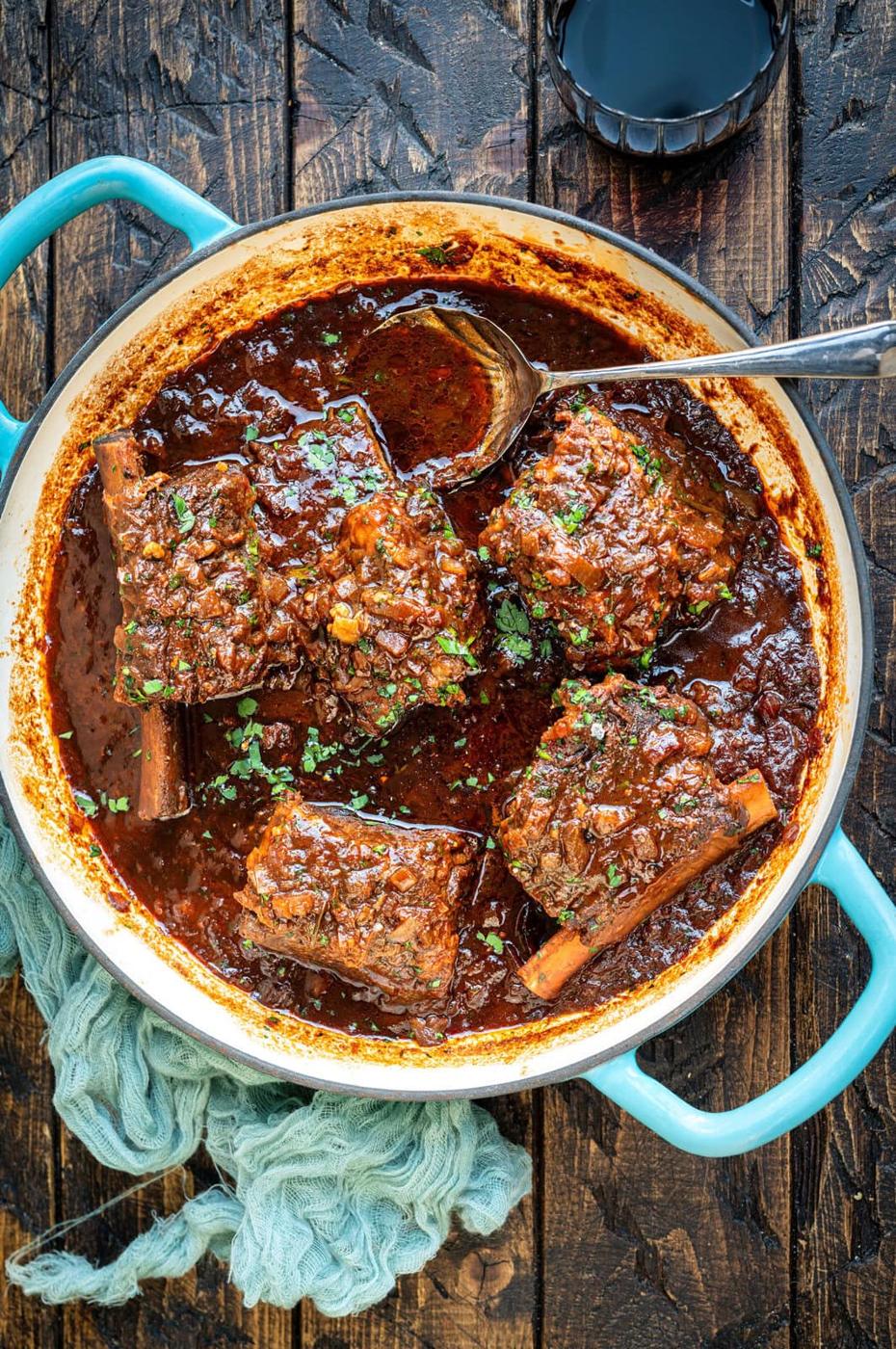 Skillet with French Onion beef short ribs in red wine braise