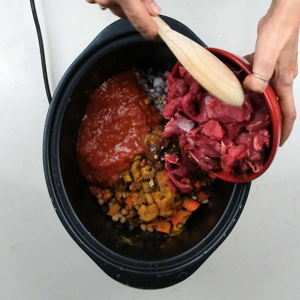 Moroccan beef stew ingredients in a slow cooker