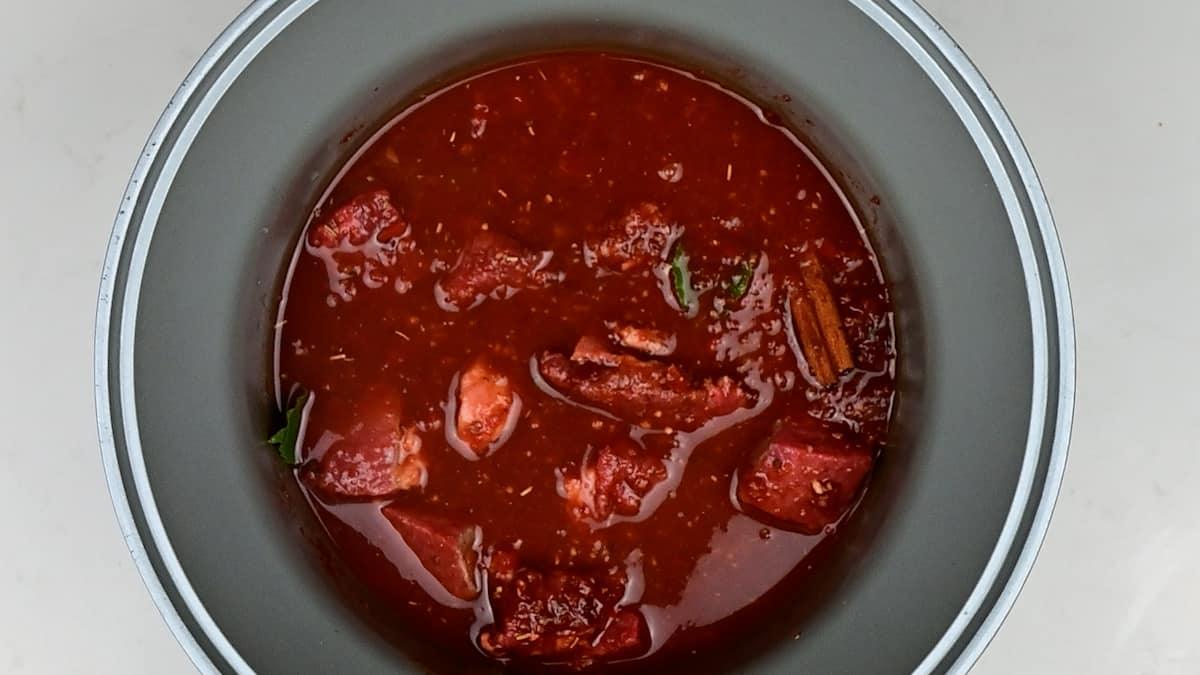 Birria stew in a slow cooker