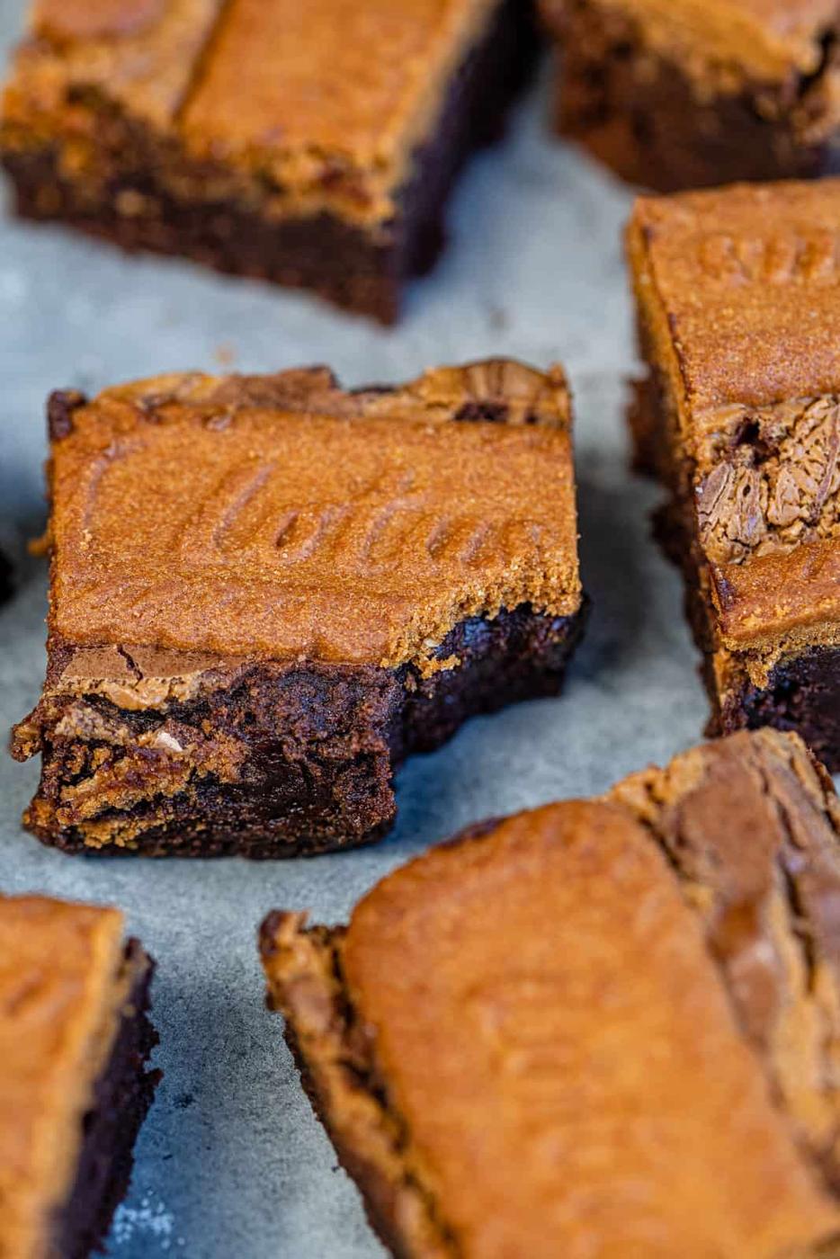 Close up on Chocolate brownies topped with Lotus Biscoff spread and biscuits