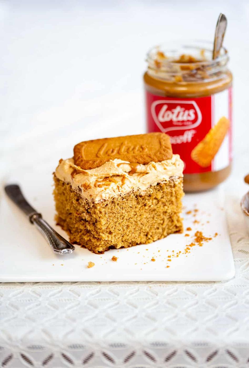 Slice of Lotus Biscoff cake topped with buttercream and a Biscoff biscuit
