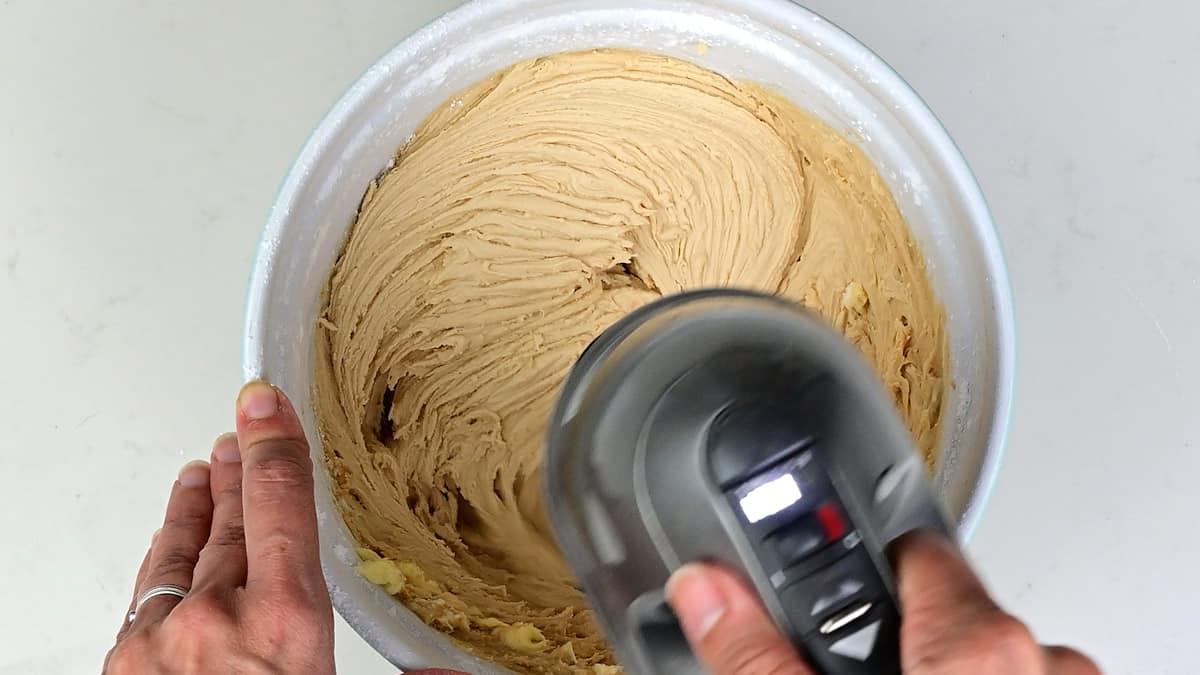 Beating Biscoff buttercream with an electric hand mixer