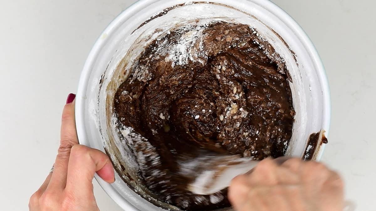 Mixing icing sugar into a bowl of fudge mix