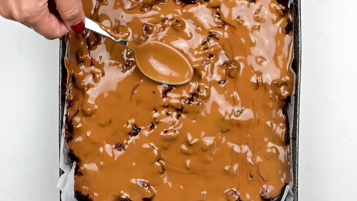 Spreading Biscoff spread over rocky road