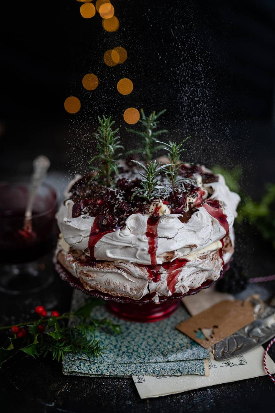 Layered chocolate Pavlova with cherries and cream