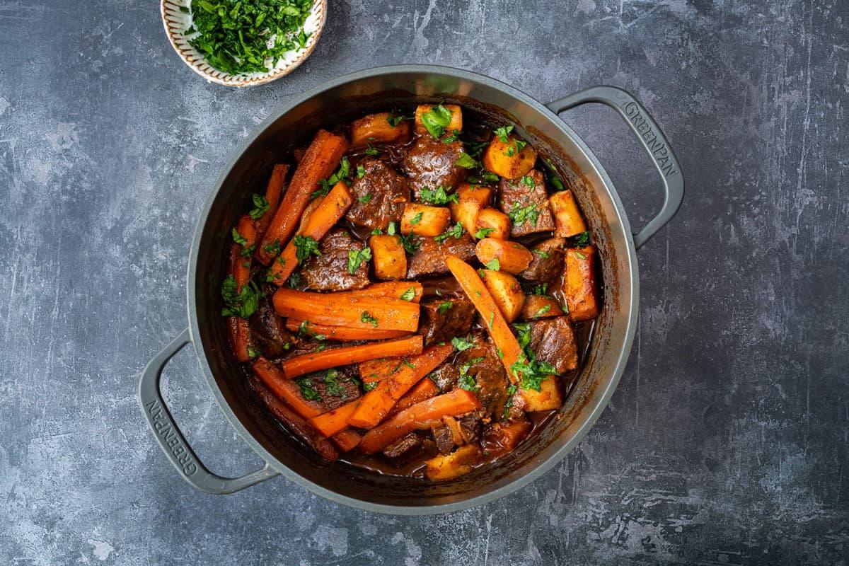 beef braised in red wine in a Dutch oven