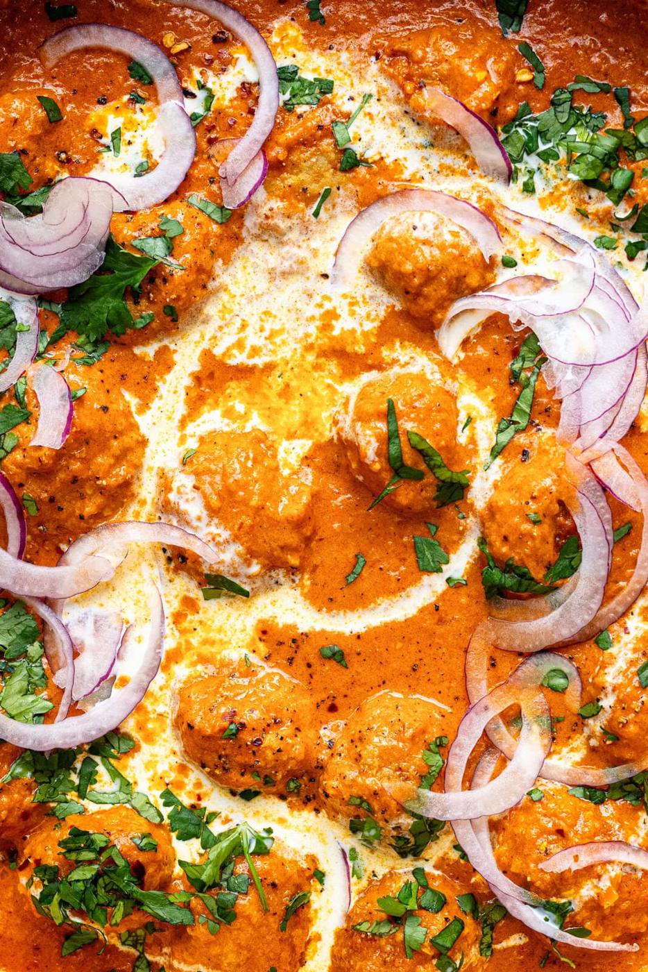 extreme close up on butter chicken meatballs