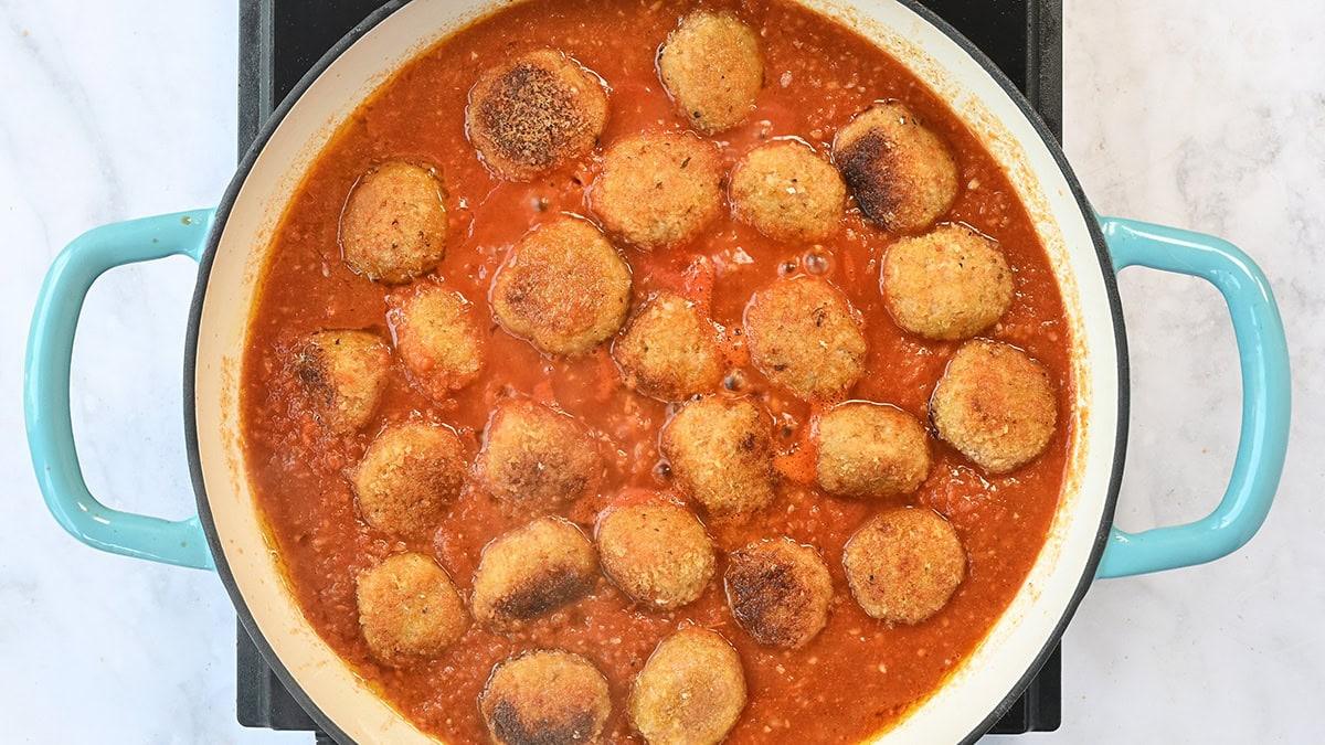 meatballs cooking in tomato sauce