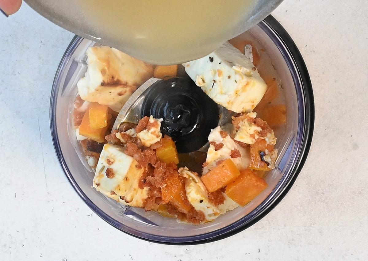 blending roast squash and baked feta with pasta water to make a sauce