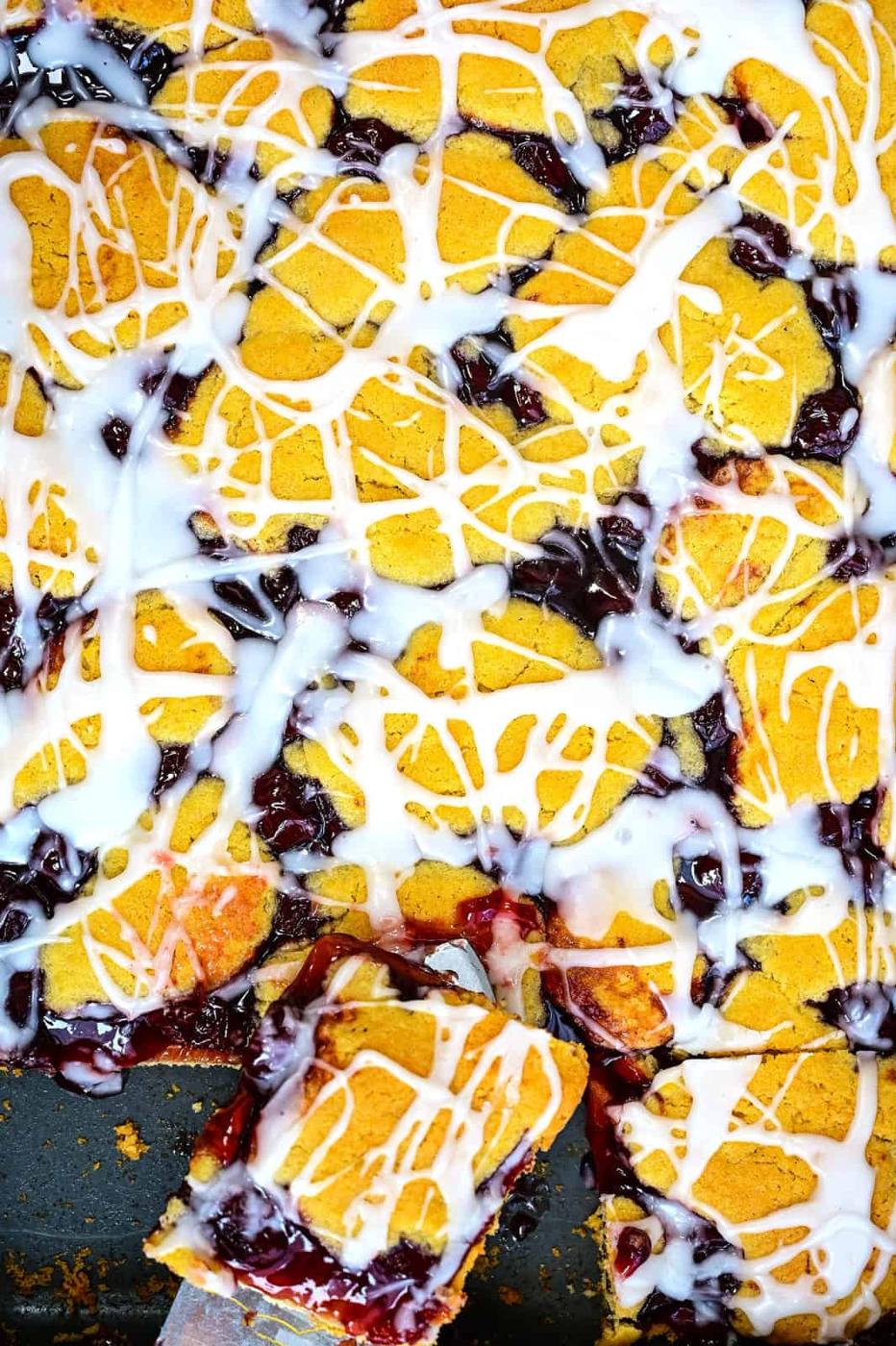 Close up on Cherry Kuchen Bars, slice cut out