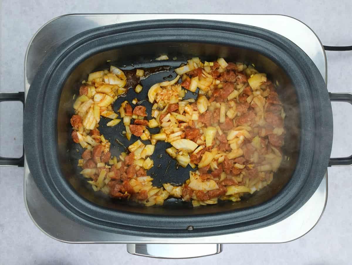 frying onion, garlic and chorizo