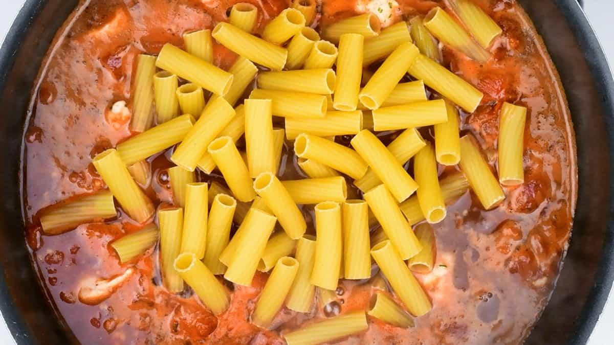 Chicken and chorizo pasta cooking in a pot