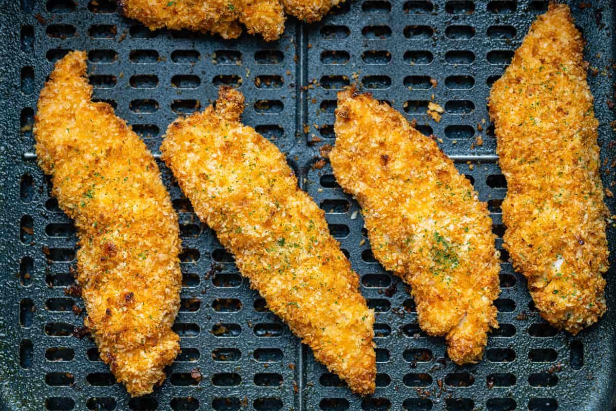 air fried chicken goujons in the basket of an Air Fryer